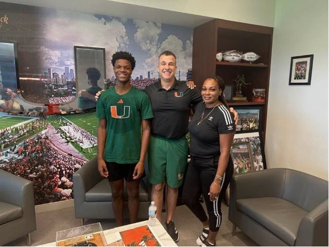 Cape Coral starting DB Darrion Jones and his mother, with Head Coach Mario Cristobal, at the University Miami's "Summer Barbecue" recruiting event.