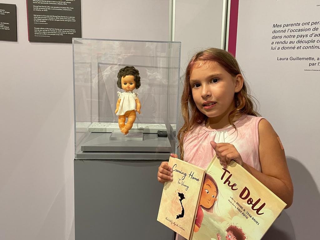nhungtrandavies's tweet photo. Love this pic of a lovely young reader visiting THE doll from my picture book #TheDoll Illus #RavyPuth @_secondstory on tour w/ @Pier21. In her hands, also the beautiful book #ComingHome by the lovely @tu_vuong, fitting for the visit #RefugeCanada exhibit @resurgoplace #Moncton https://t.co/k6xdODAcZw