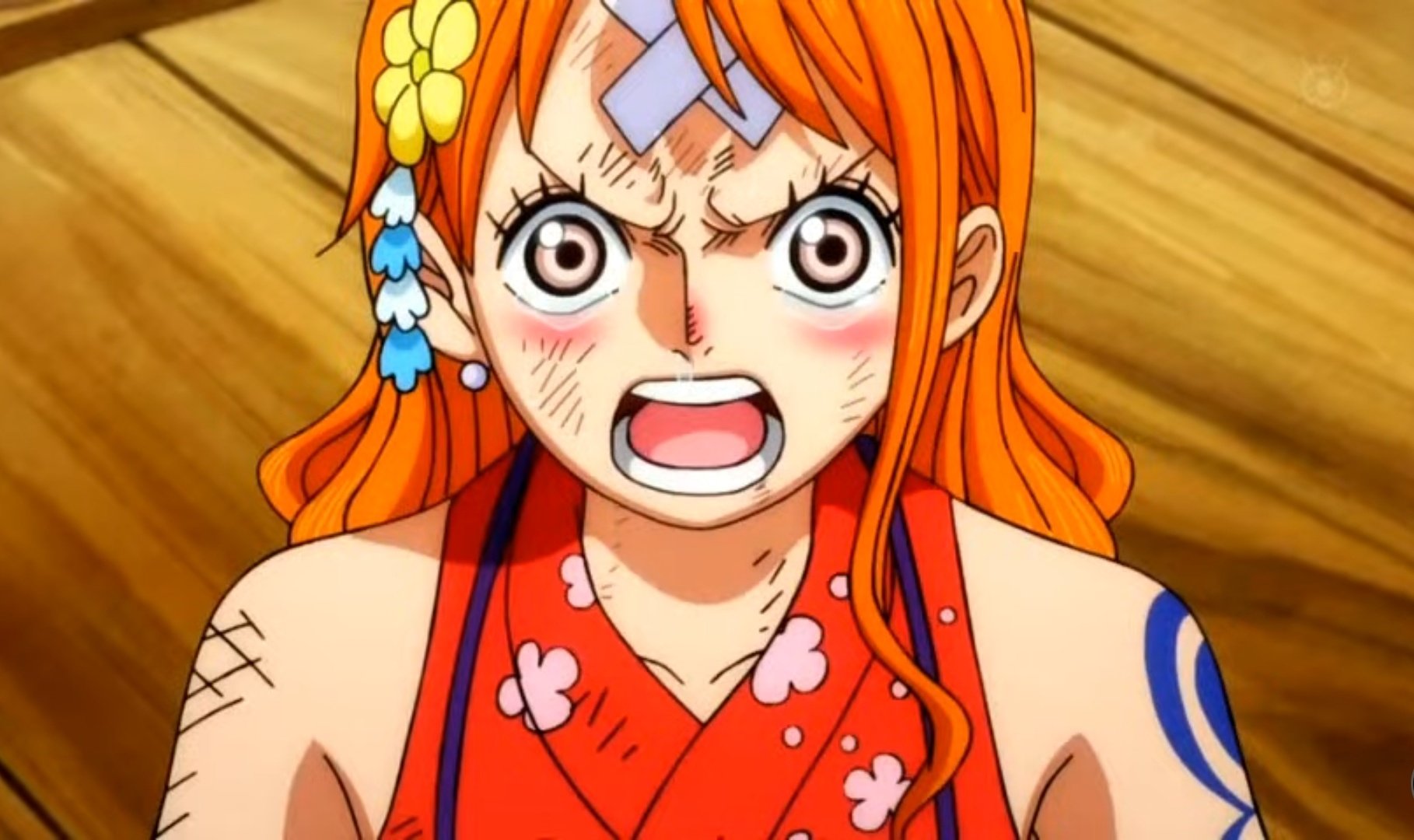 Nami crying after Luffy put his hat on her