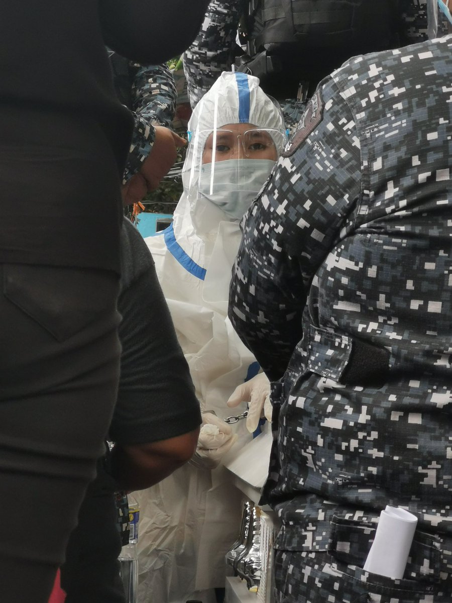 soltaule's tweet photo. Throwback: photos taken during the burial of Baby River. Reina Mae was in full PPE with handcuffs. She was heavily guarded by uniformed men in full battle gear at the cemetry. I remember asking the man in the last photo: “sir, para po saan yung dala niyong mahahabang baril at malalaking bala?”