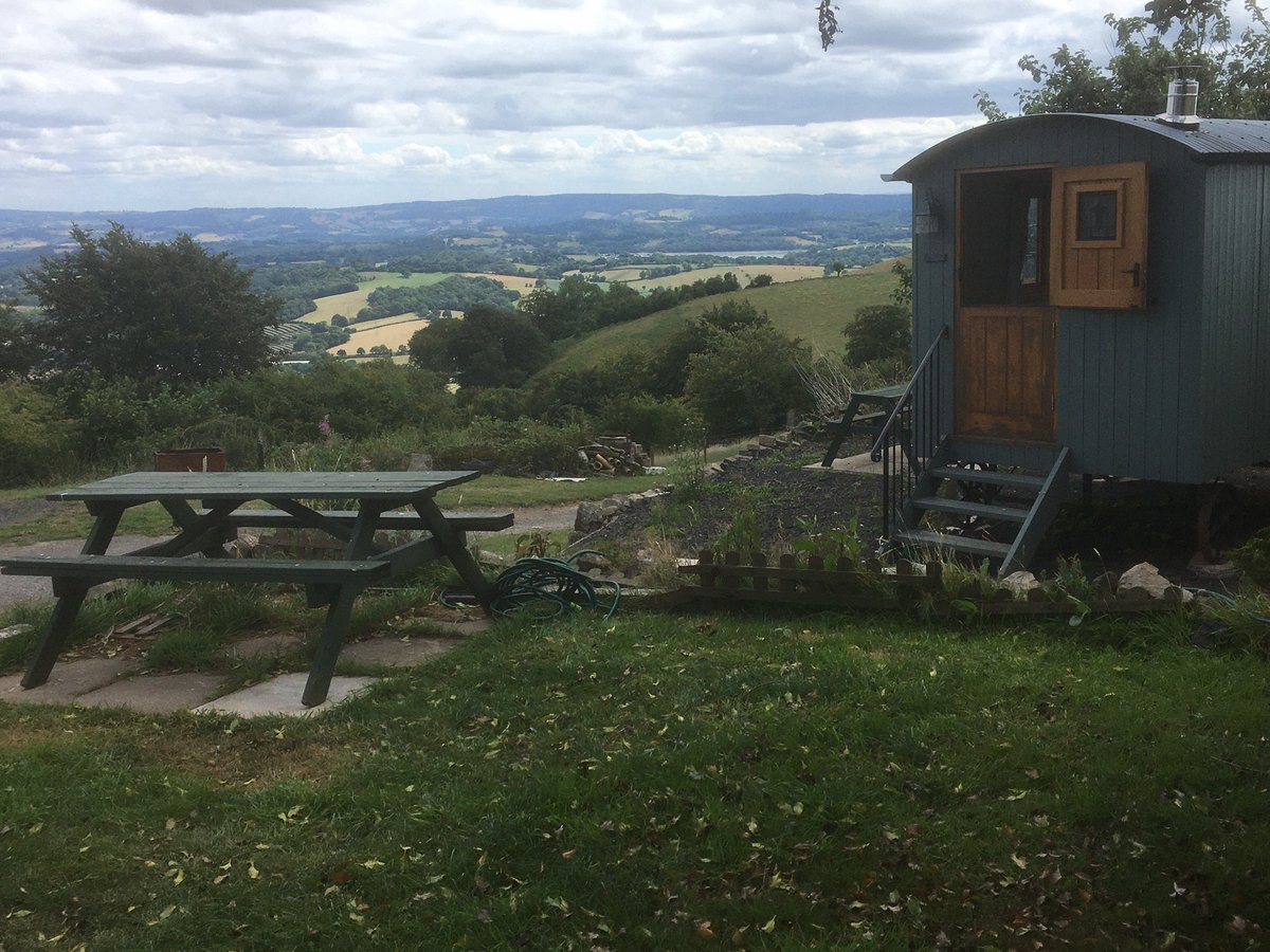 VicWarren1's tweet photo. Our small but beautifully situated camp site  going well, apart from weather! Tents welcome or stay in our Shepherds Hut. Call 01495 755557 https://t.co/0omrNQhAFG