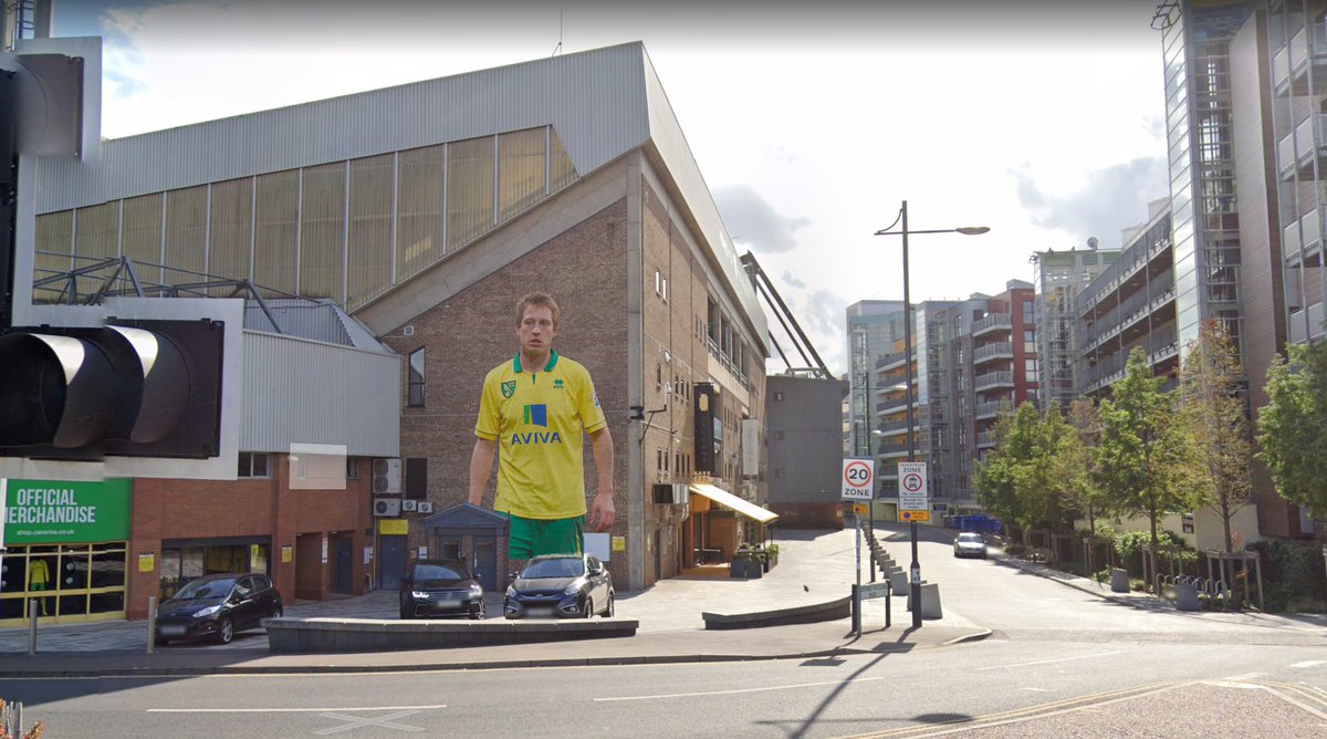 jamesrobinson78's tweet photo. Murals are slowly popping up everywhere 💛💚. Only got a glancing peek past carrow road but the new 'Luciano Becchio Stand' is taking shape. #otbc https://t.co/AnLcC8eRdP