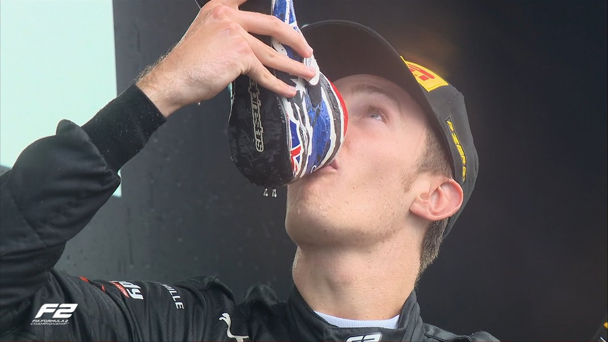 Formula2's tweet photo. DOOEY SHOEYS ALL ROUND! 🍾👞

How's it taste, @TPourchaire? 😜

#BelgianGP #F2 https://t.co/rMzyUZsmQG