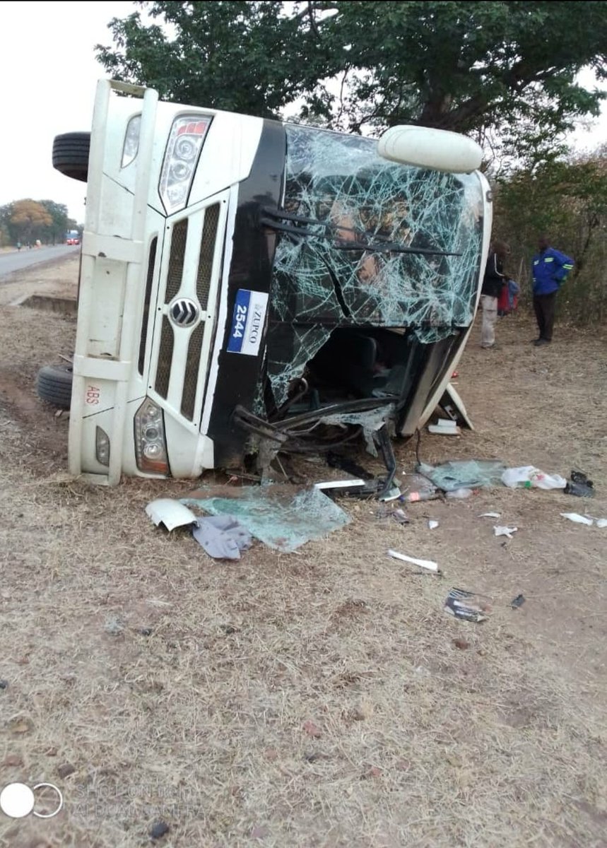 zimlive's tweet photo. 🚨𝐉𝐔𝐒𝐓 𝐈𝐍: Zupco bus ferrying ZANU PF supporters has overturned just 5km from Lupane on the way to Nkayi to attend a rally to be addressed later today by President ED Mnangagwa. https://t.co/2BqnWZyaJb