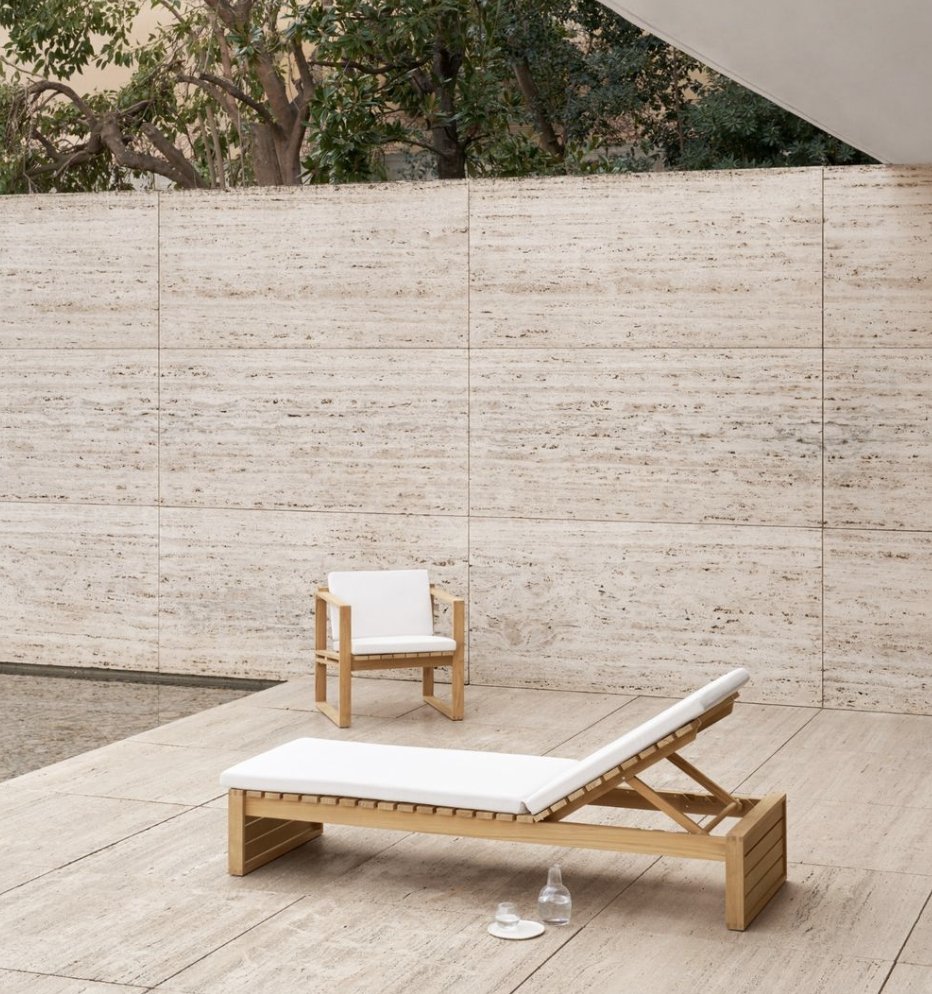 Luxury lounging with #CarlHansenandSon and the Bodil Kjærs collection. Solid teak construction, simple geometric quality and designed to weather beautifully over time. #carlhansenandson #outdoorcollection #Bodilkjær #DanishDesign