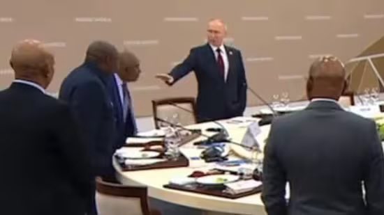 renoomokri's tweet photo. I see African leaders attending the Africa-Russia summit, Africa-French summit, the Africa-UK summit, or the Africa-China summit. First of all, these summits never hold in Africa. They are always held outside the continent. Why should the leaders of a continent with 54 countries travel to Europe or Asia for a summit with one leader? Does it not make better economic sense for that one leader, be it Putin, Macron, or Xi Jinping, to travel to Africa? 

But, of course, it is not about what is right, proper or convenient. It is about power. To subdue African leaders. To assert dominance over them. 

That is why these summits, sadly, consist of African leaders kowtowing to White saviours. 

I mean, look at how the President of Comoros, Azali Assoumani, was grovelling to Putin on video over sitting arrangements and protocol. So disgusting! 

Look at the attached photograph. Just see the messaging that is communicated by Putin's hand gesture. 

And after going to such extents to suck up to Putin, African leaders left Moscow with neither a grain deal nor a peace agreement. What was the essence of the trip? 

Look, African Americans in the USA have a combined wealth that is more than that of the collective GDP of sub-Saharan African nations. And then Africans in the diaspora send more money back home to Africa than the World Bank and the IMF combined.

If Africa really wants to improve its economy, the summit we should be having is a world Black African summit, for example, to unite the Black diaspora. 

We should collaborate with the US Congressmen Black Summit and deliberate on how African Americans and Caribbean Blacks can reconnect with Africa, just as the Jewish diaspora is connected to Israel. We should be looking at a right of return to Africa for all Blacks, whereby if you can trace your DNA to any African country, you should be legally entitled to a passport, just as Israel does for the global Jewry. 

Only by uniting the global Black race can we have the type of financial and technological transfer, as well as the reverse brain drain that Africa needs to develop. 

Russia, the West, China and other powers would not do it for us. Helping us become a rival economic and military power to them goes against human nature, which seeks its own self-interest.

Conversely, it is in the interest of the African American and Caribbean Blacks for Africa to succeed. And that is where we should be directing our diplomatic efforts to. 

#TableShaker