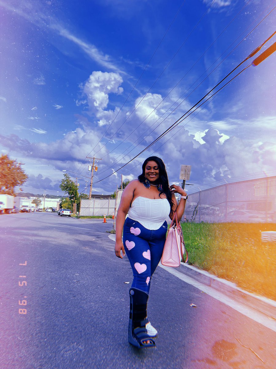 thee_different1's tweet photo. The purse, boot, and clouds are all paid actors 💕💁🏽‍♀️ https://t.co/MyGROBSJm7