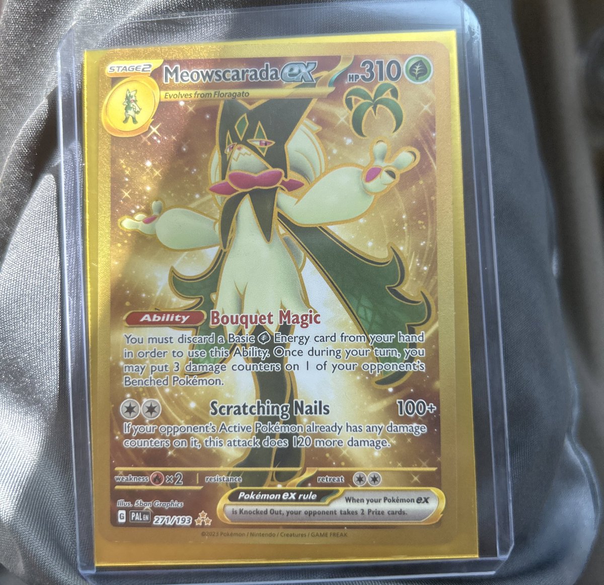 just pulled a Gold Meowscarada ex (second most wanted card in the set) at a card shop and they gave me a free sleeve and top loader LOL life is good