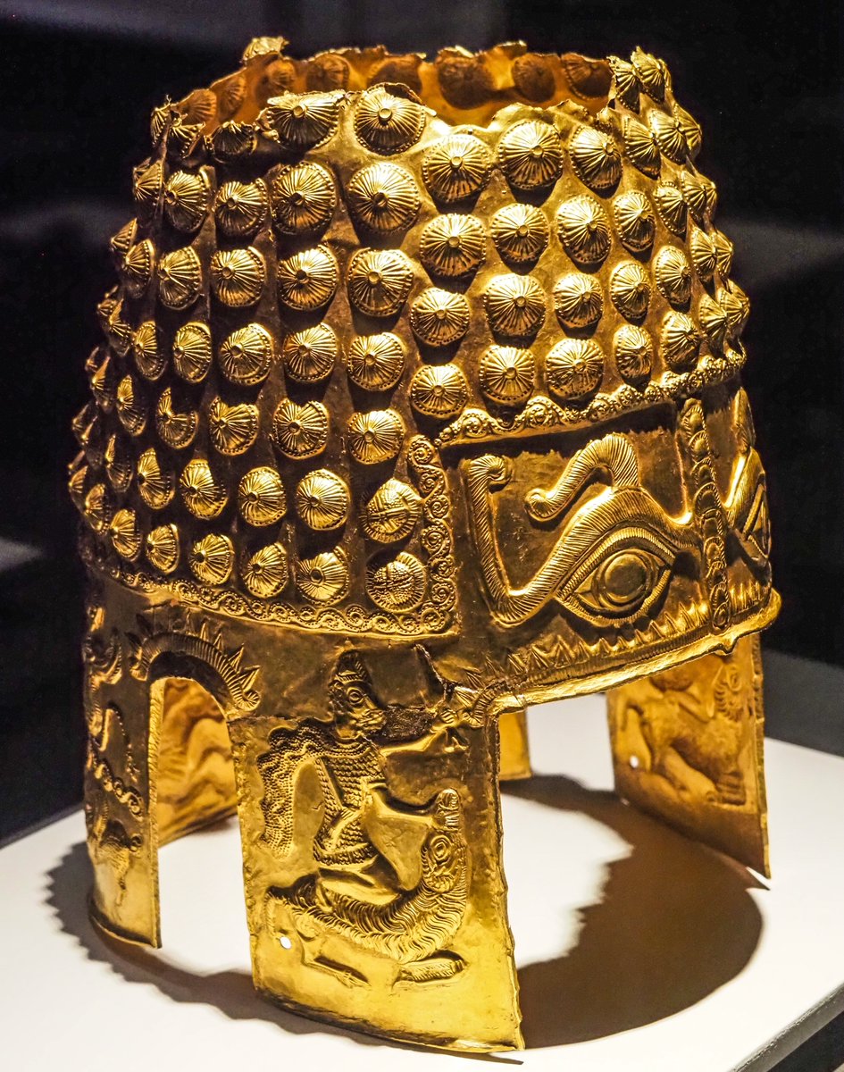 OptimoPrincipi's tweet photo. The incredible golden helmet was discovered in 1929 near the Romanian village of Coțofenești - unearthed by chance by a young local boy named Trajan. The Golden Helmet of Coțofenești is fashioned from a kilogram of solid gold, decorated with large studs on the top of the skull and two piercing apotropaic eyes, meant to ward off the evil eye and malevolent magic spells. Decorating the cheek guards are scenes of animal sacrifice, with men preparing to cut the throats of a bull and lamb with short daggers. The ceremonial helmet is thought to have belonged to an unknown local Geto-Dacian king from around the year 400 BC and offers a fascinating insight into the proto-history of the rich Dacian kingdom, destined to be conquered by the Roman emperor Trajan, 500 years later. National History Museum of Romania, Bucharest.