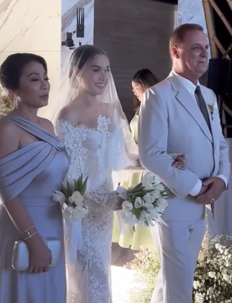 Walking her down the aisle to the altar

#MajaRamboSayIDo
TheMajesticWedding