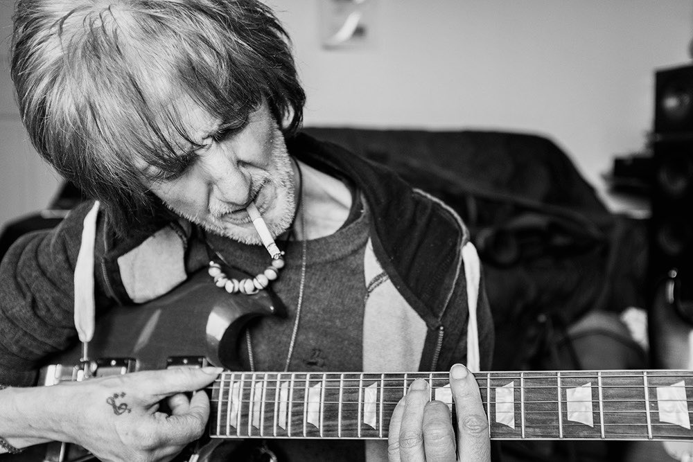 Vini demonstrates the C major barre chord while smoking no handed. Didsbury 2015. Another image from the series At Home with Mr Reilly.

#photography #ViniReilly #portraitphotography #portrait
