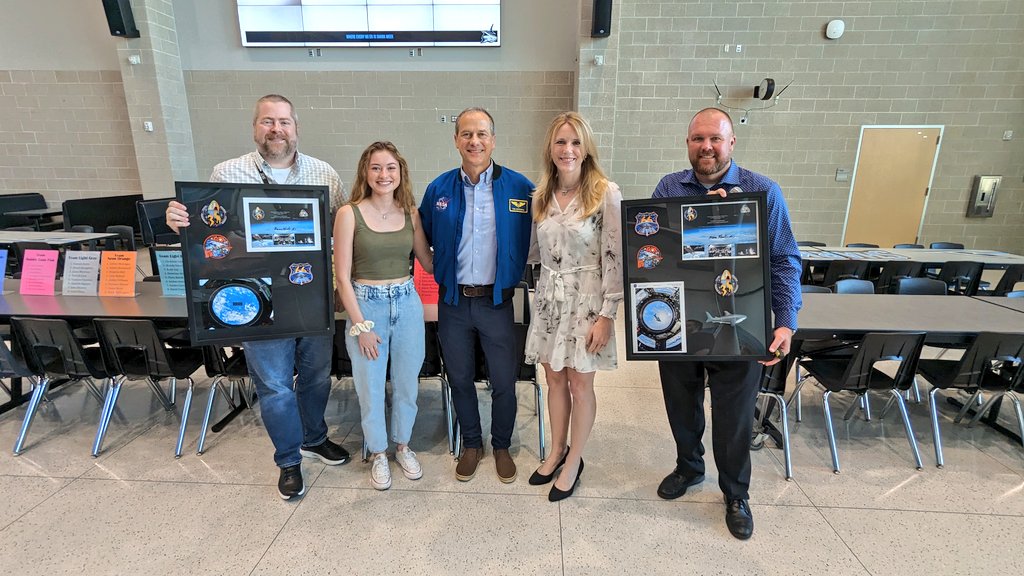 ShadowCreekHS's tweet image. Tom Marshburn, his wife and daughter Grace, a SCHS Band alumna, make a surprise visit to present Mr. Mooney and our SCHS Band with a framed copy of the SCHS Band sticker that was flown aboard the International Space Station during expedition 66 &amp;amp; 67.