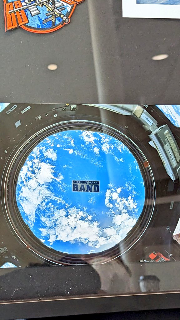 ShadowCreekHS's tweet image. Tom Marshburn, his wife and daughter Grace, a SCHS Band alumna, make a surprise visit to present Mr. Mooney and our SCHS Band with a framed copy of the SCHS Band sticker that was flown aboard the International Space Station during expedition 66 &amp;amp; 67.