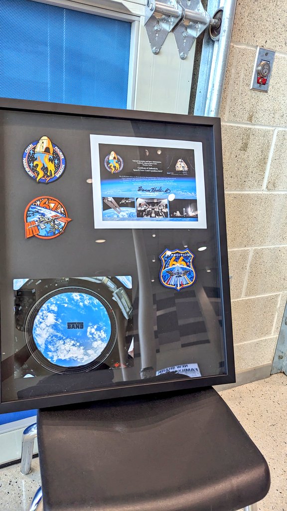 ShadowCreekHS's tweet image. Tom Marshburn, his wife and daughter Grace, a SCHS Band alumna, make a surprise visit to present Mr. Mooney and our SCHS Band with a framed copy of the SCHS Band sticker that was flown aboard the International Space Station during expedition 66 &amp;amp; 67.