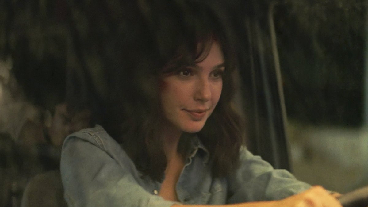 IGN's tweet photo. Gal Gadot drives like hell to avoid her pursuers in this exclusive clip from her new Netflix action film Heart of Stone: https://t.co/61FIFY54cG https://t.co/TncXiyTRUZ