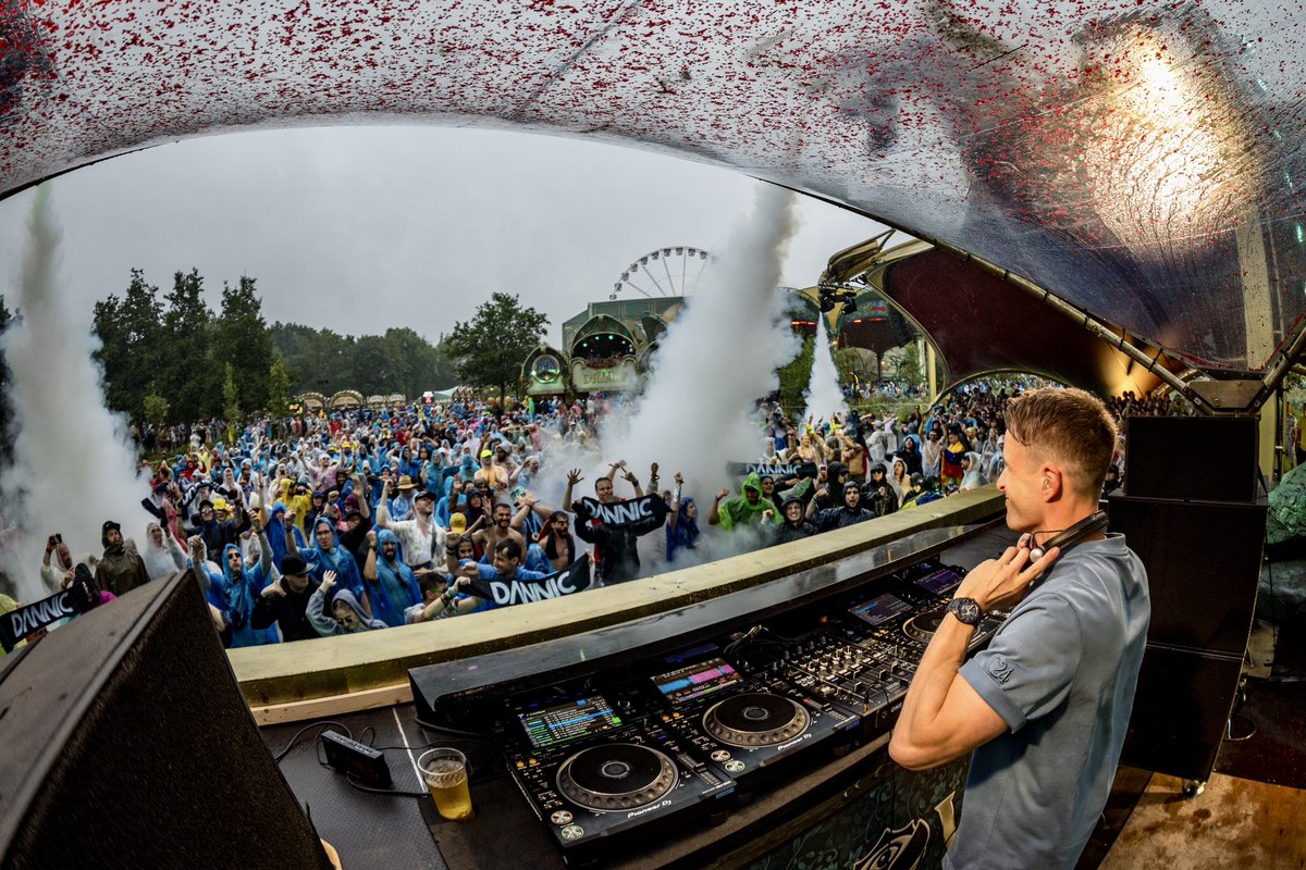 dannic's tweet photo. Tomorrowland last night! Huge thanks to everyone partying with me in the pouring rain and @HARDWELL for showing up ending the set with an epic b2b 🫶🏻❤️ https://t.co/bdb8IWgGIk