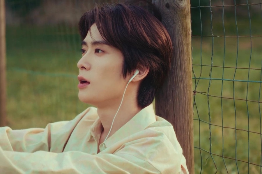 soompi's tweet photo. WATCH: #NCT's #Jaehyun Gazes At The "Horizon" In Aesthetic Solo MV 
https://t.co/SD5ks4U4Zr https://t.co/PdZnYGkfMO