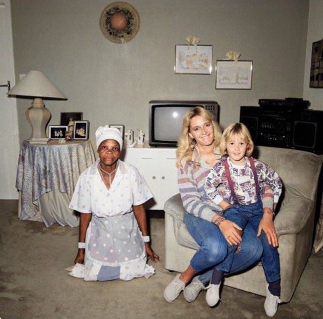 Tson_Tso's tweet photo. This is Elon musk and his parent. They had a black women helper. Who was not allowed to seat on their sofas. Who was not allowed to ask any questions. Elon musk is a racist white man like his parents. https://t.co/om9proJCl6