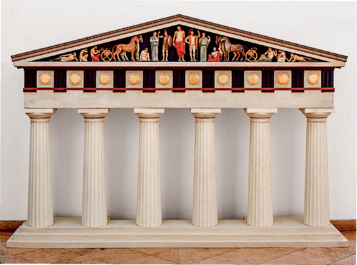 And not only statues.

Greek and Roman temples were decorated with friezes — sculptures carved into walls — and rather than being left as pure stone, it seems they were covered with polychromy (bright, varied colours).

This model of the Temple of Zeus was made in 1886: