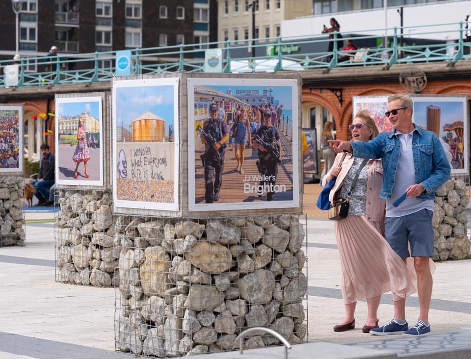 Great photo by JJ Waller of a couple spotting themselves in a photo by JJ Waller. There's an al fresco exhibition of the street photographer's work, featuring Brighton seafront, outside i360 through August. Meta meta
jjwaller.com