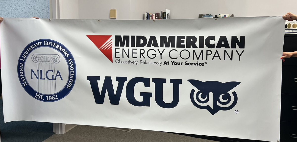 NLGA's tweet photo. Behind the scenes at NLGA:  The first Annual Meeting sign is unfurled!  Thank you Western Governors University (WGU) and MidAmerican for the State Fair sponsorship!    … @wgu https://t.co/zGbIhk4M9b
