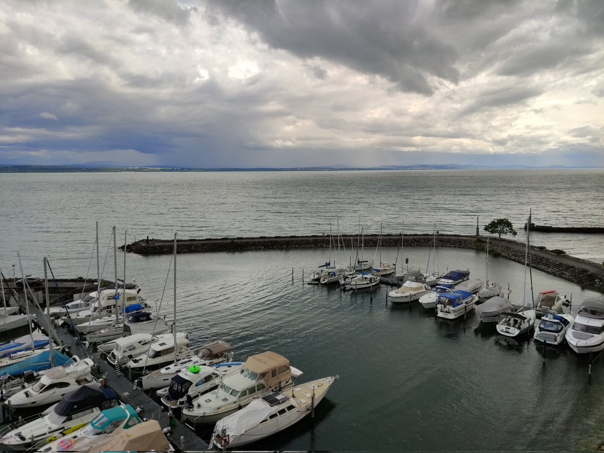 SarahvonA's tweet photo. The weather could be better, but the view from our room makes up for it! #FeteNationale #HappyBirthdaySwitzerland #Neuchâtel https://t.co/riWLeMCIEI