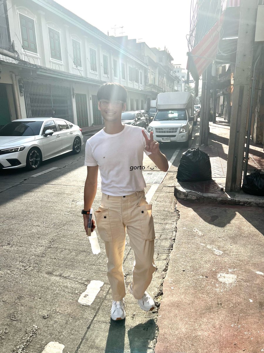 fouryellow_'s tweet photo. apo wearing glasses and new shoes while holding a book around Songwat 🤧🤧 such an attractive little things to do 💖

━ ♡ 
@Nnattawin1 #Nnattawin https://t.co/wydfE5G03w