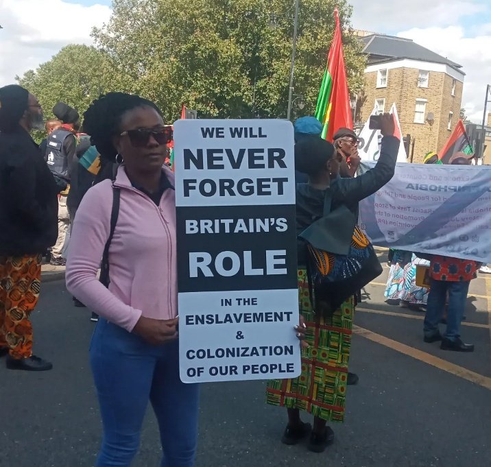 @akieboss_9_ with a powerful sign at the #EmancipationDay March in #Brixton. This sista is from Trinidad and Tobago 🇹🇹 ✊🏾