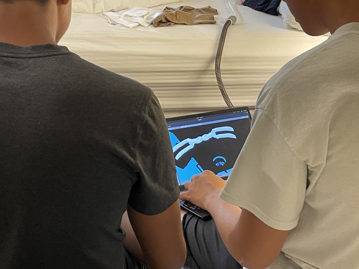 AVBotz's tweet photo. Competition Day 2:  
Photo 1: AVBotz arrives at the Team Orientation  
Photo 2: Craig and Ryan adjust grabber position in the simulator
Photo 3: Software Team practices their part of the design presentation  
Photo 4: Testing thrusters and movement late into the night https://t.co/CFdEijmKYL