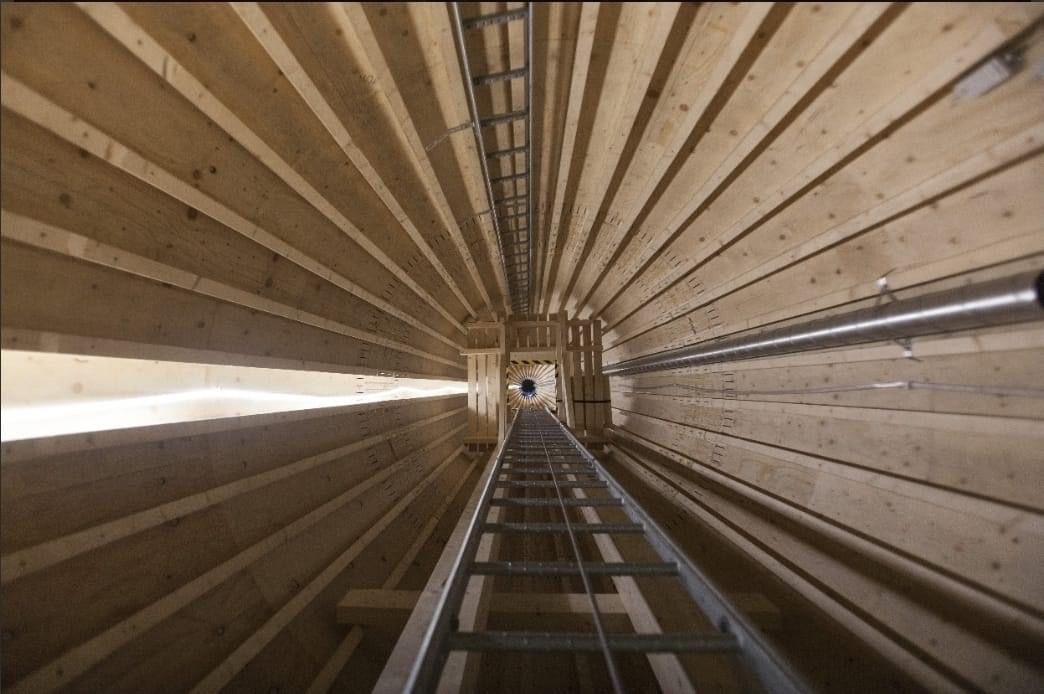 SolarInMASS's tweet photo. This is the world's tallest (105 meter) *wooden* wind turbine base - 2 MW of capacity - that was recently constructed in Sweden. Atop the unit is a standard Vestas turbine and blades. https://t.co/lO7npqgaOz