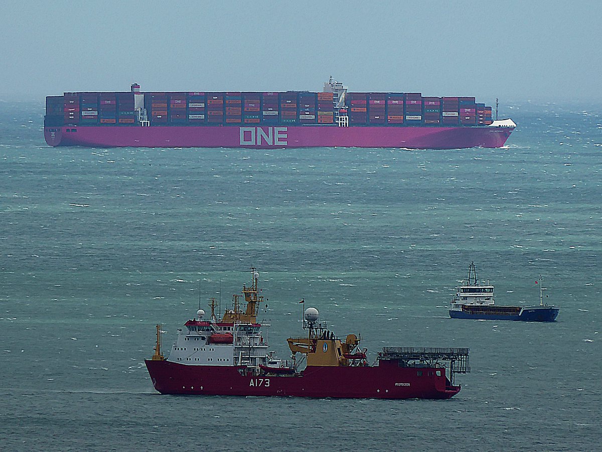 Container  ship One Meishan landing a deep sea pilot at Brixham this afternoon while outbound from London Gateway to Jeddah, Saudi Arabia. The two ships sheltering in Tor Bay are @hmsprotector  and the coaster Isartal.