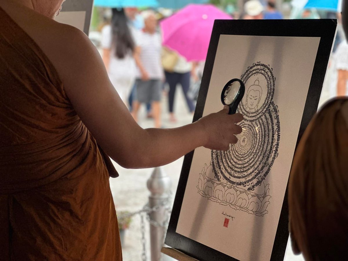 IndiainThailand's tweet photo. It is heartening to see that the Buddhist Exhibition “Buddha Carika - in footsteps of Buddha” orgnsd by the Embassy at Ubon #CandleFestival is attracting young crowds. The exhibits include select pictures of important Buddhist sites in India and books on #Buddhism. https://t.co/niPPlSGKad