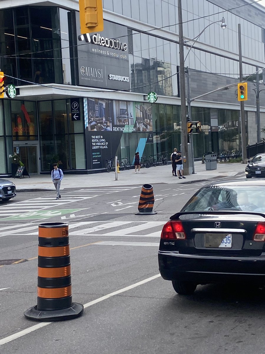 itsryanjoseph's tweet photo. @cityoftoronto this pilon has been at the intersection of Strachan and E Liberty for a few days now and cars are carelessly swinging into the bike lane to avoid- super dangerous and it’s been left unattended. Can you help? https://t.co/pgHqiL5Xbv