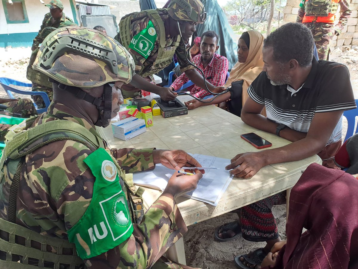 ATMIS_Somalia's tweet photo. Yesterday, #ATMIS @kdfinfo troops stationed in #Kuday FOB in Middle Juba, provided free medical checkup and treatment to over 200 families. The officers met with local leaders and discussed priority issues among them health, education, and security. They also donated 500 tree seedlings as part of the ongoing #ATMIS conservation initiatives. #ATMISInTheSectors