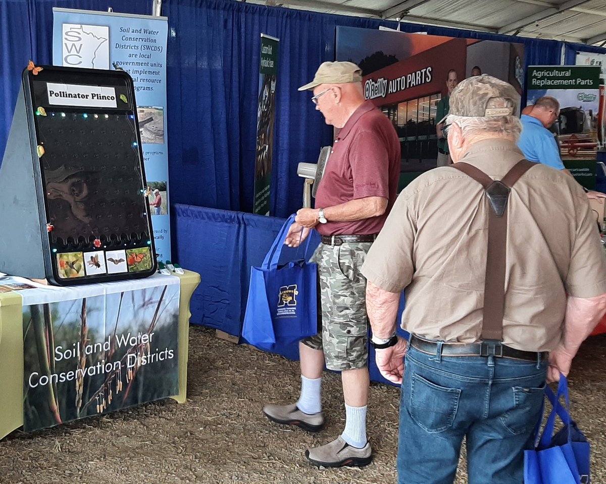 MNBWSR's tweet photo. At #Farmfest in Redwood County this AM? Say hi to Kane Radel, #MnBWSR wetland mitigation specialist. He’s in the Minnesota Association of Soil & Water Conservation Districts' booth till noon, talking #pollinators, #wetlands + #conservation. #MASWCD @MnSWCDs @MNFarmfest https://t.co/AkkEyBFyap