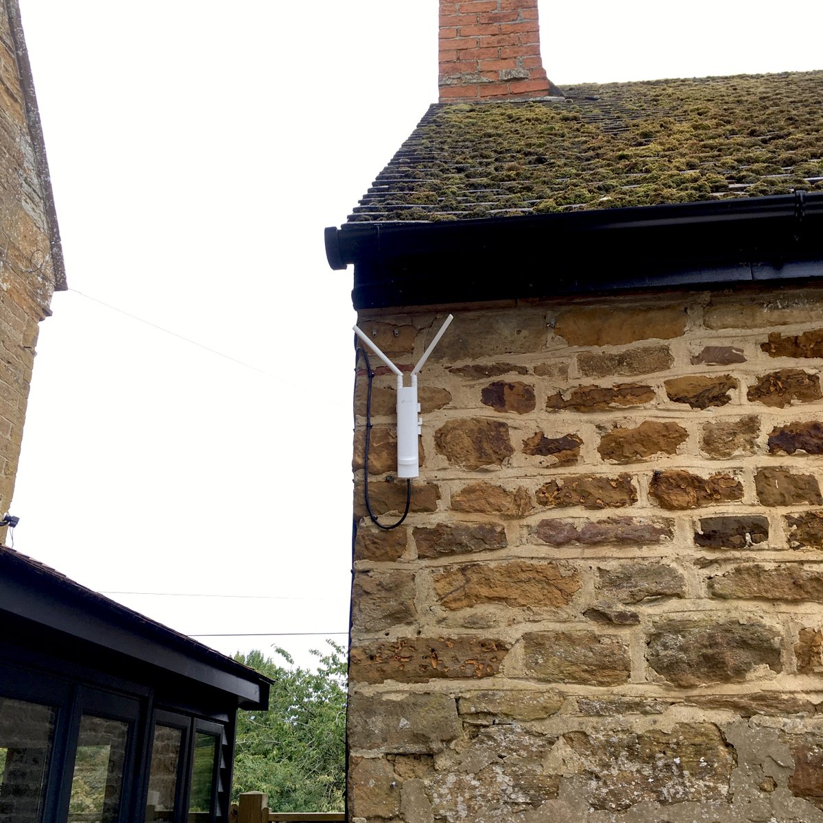 External TP-Link #Omada  AP installed providing WiFi connectivity to an outside office pod and garden area.
-Hardwired Cat6 ethernet backhaul with cabling discreetly routed under the soffit out of sight on the front aspect. #gardenoffice, #mancave, #summerhouse #daventryAerials