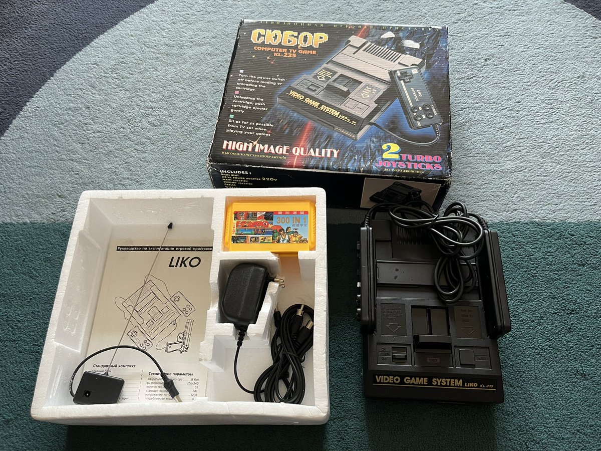 I'm always a sucker for old famiclones. This is called a Lika KL-235, similar to a Dendy. Originally it had a light gun for it, but I had to throw it out because the TSA stopped me and called the Feds on my ass over a toy gun. <a href="/BootlegConsoles/">Bootleg Consoles</a>