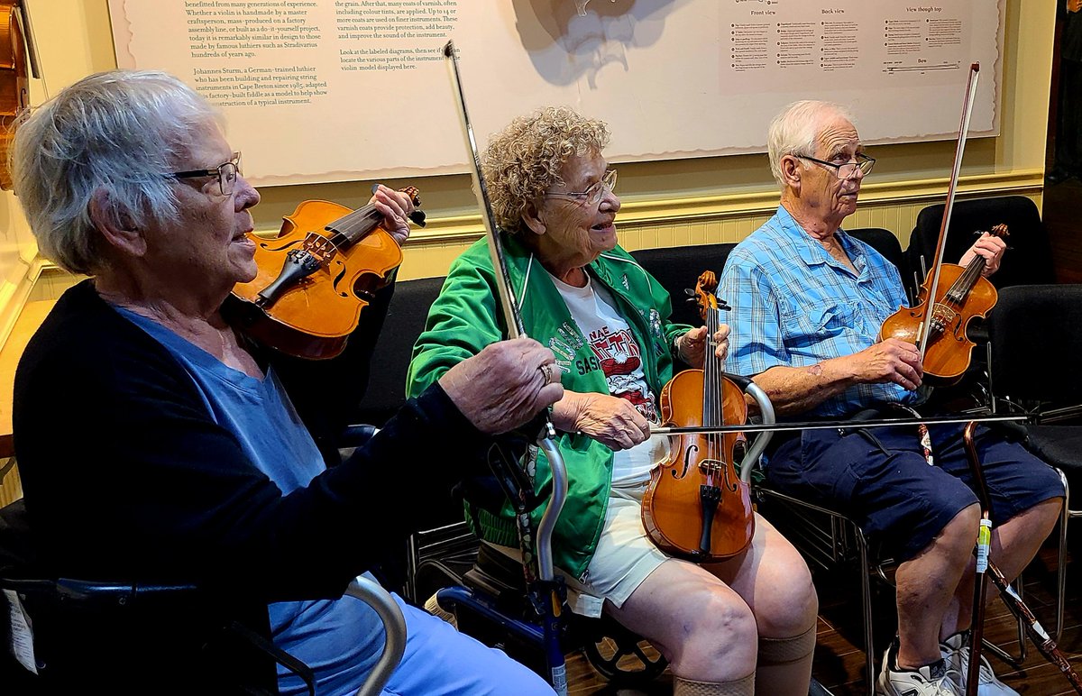 GreyCupBound's tweet photo. The crew cuttin' the rug learning to play fiddle at the #CelticMusicCentre in Judique, Nova Scotia. #VisitNovaScotia #ExploreCB โค๏ธโค๏ธโค๏ธ https://t.co/p5QEv7mLfq