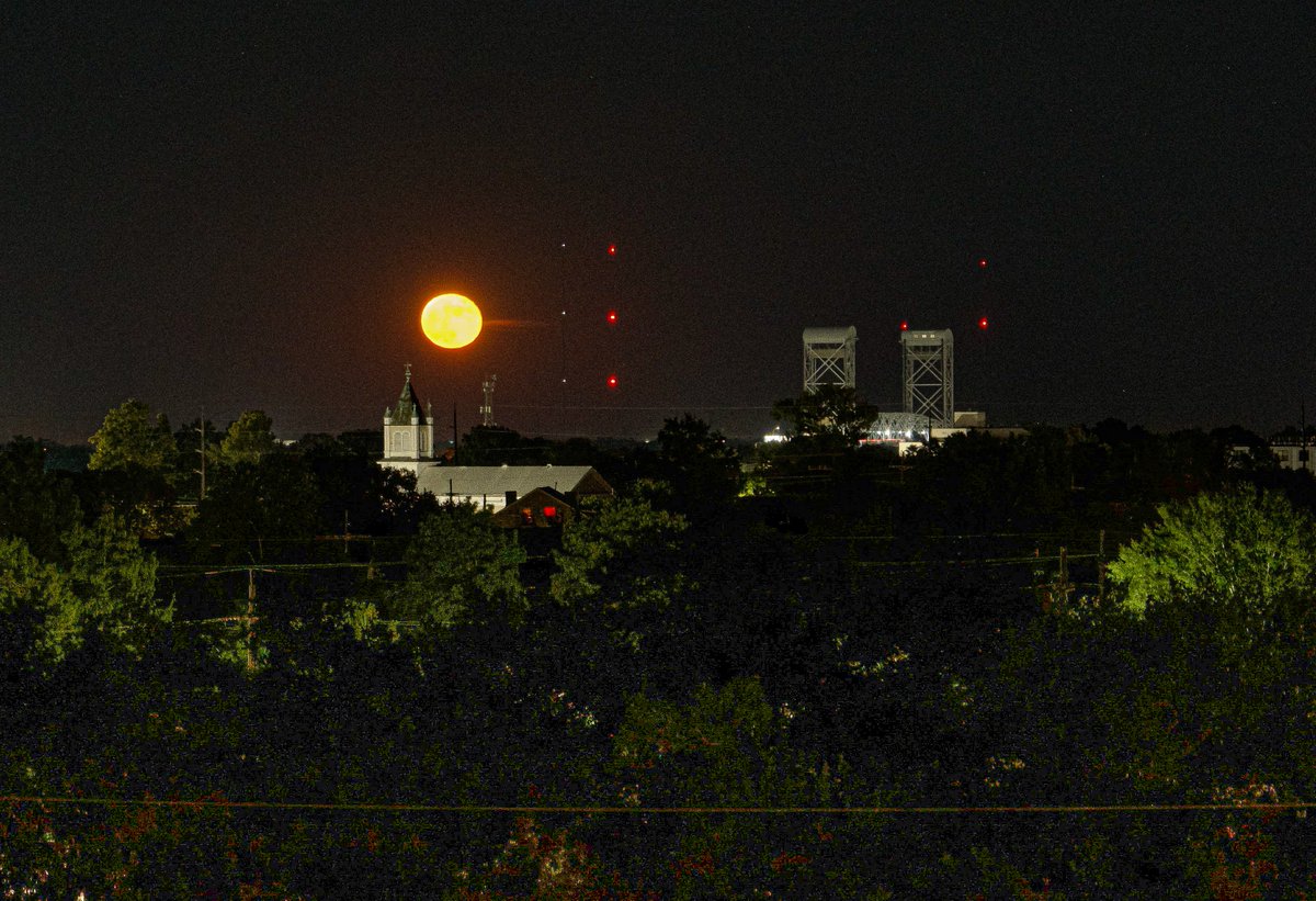 A full moon rises over St Paul Lutheran Church, Marigny, New Orleans