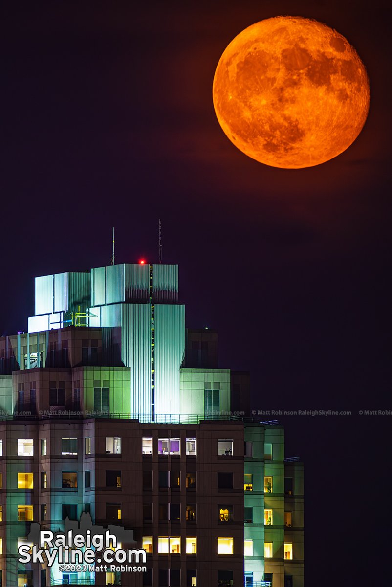 Tonight's 99.8% full supermoon rise over downtown Raleigh with hazy conditions giving it an extra orange appearance on the horizon. 🌕