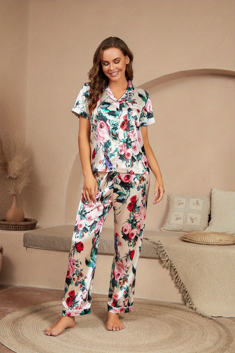 🌺✨ Indulge in chic comfort with our Floral Print Satin Pajama Set! The short sleeve button-up top and elastic waistband pants offer the perfect combination of style and luxury for women's sleepwear & loungewear.  #PajamaSets.co #WomensSleepwear #FloralPrint #LuxuriousComfort