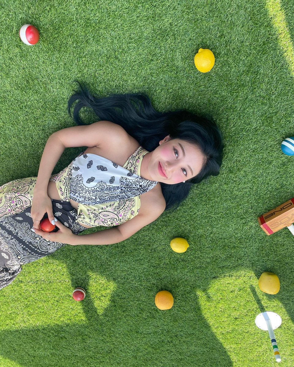 Jihylo's tweet photo. In the warm embrace of summer, the girl relishes the sun's gentle caress, adorned in a beautiful flowing dress that dances with the breeze. Lays upon the soft, verdant grass, a tranquil smile graces my face, and my eyes sparkle with delight. https://t.co/KjCrrftJL9