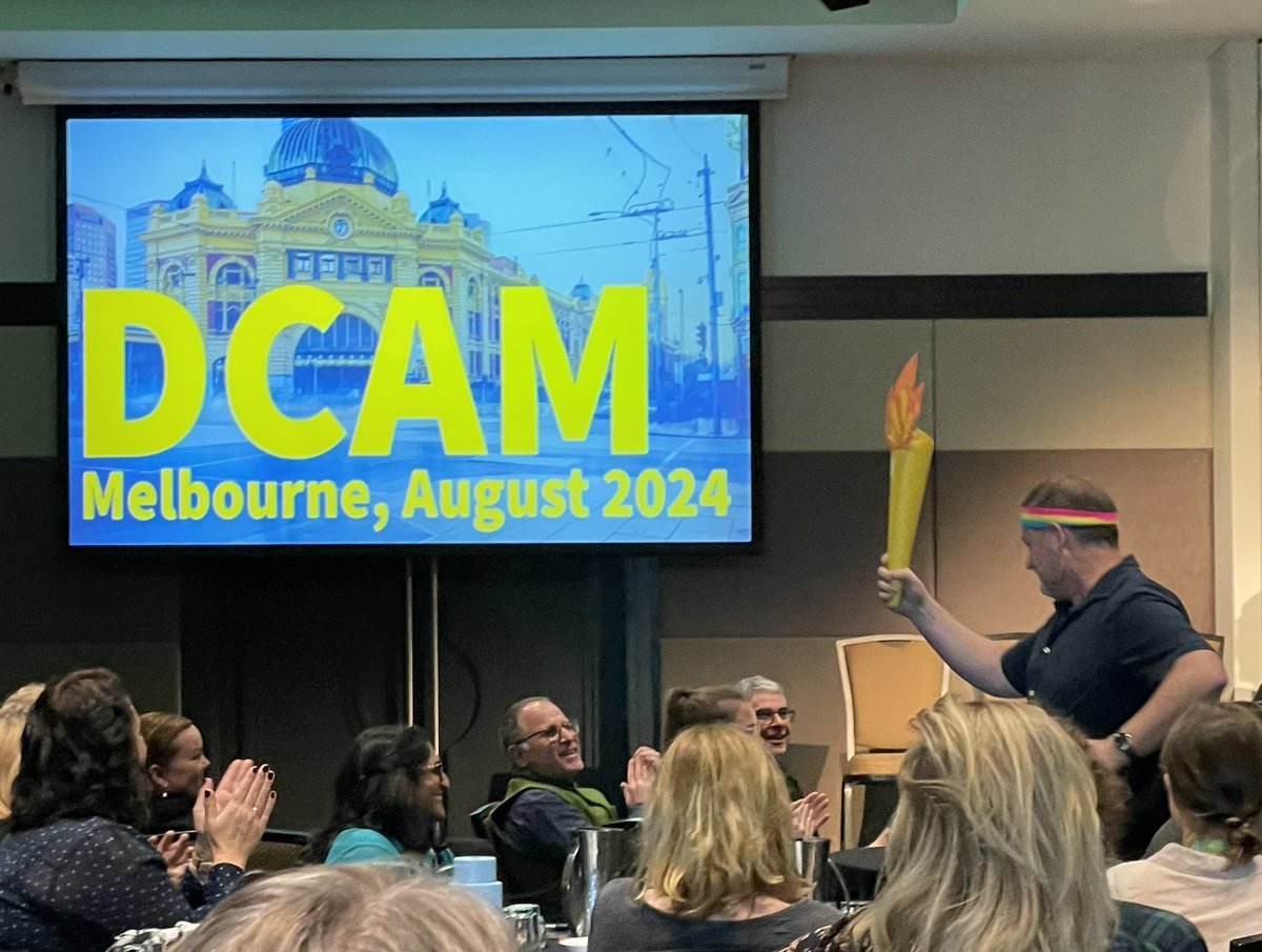 dezuanni's tweet photo. @tamaleaver hands the  #DCAM baton on to @seftongreen signalling the move from WA to Vic in 2024 - in a fitting ceremonial moment @digitalchildau https://t.co/Ci6V5T6JeX
