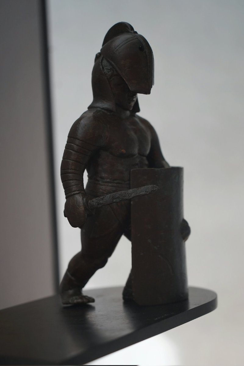 TimeTravelRome's tweet photo. ☀️ This statuette of a #gladiator was found near the Amphitheater of #Arles. It's a #secutor - his helmet had a rounded shape, so that his adversary #retiarius, armed with a trident and a net, could not catch him easily. Now in Arles museum. 📸 Own pics. https://t.co/rE4ZurStTr