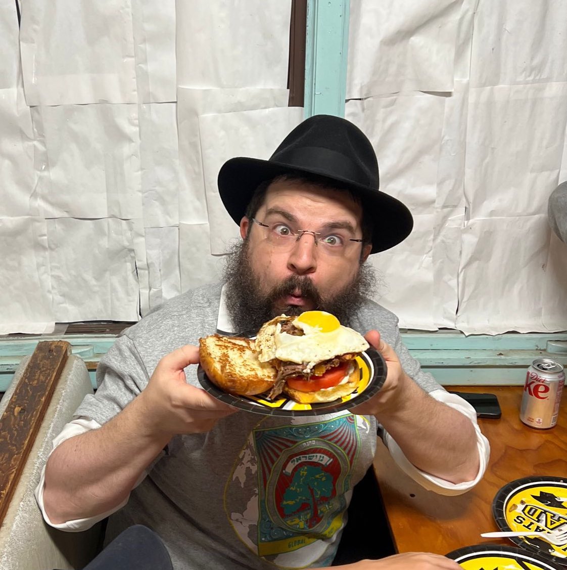 canteencgi's tweet photo. Singer Benny Friedman enjoying a signature #Mendels burger with a delicious fried egg on top, after an incredible concert last night in Gan Yisroel!! https://t.co/N7Ry2TeXGn