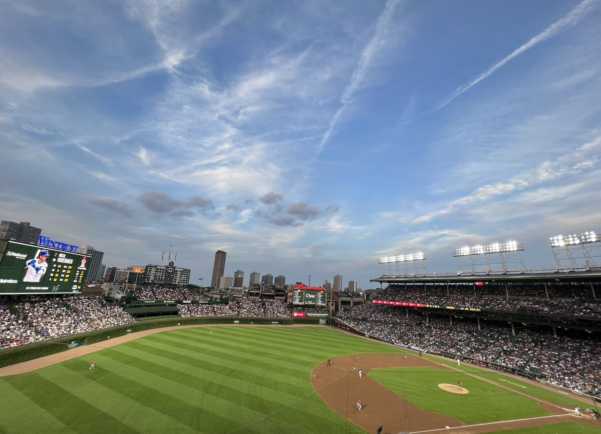 jimeasterhouse's tweet photo. thank you to @O_Trayn, my favorite fan of the other Chicago baseball team, for a lovely evening at Wrigley Field! I’m a lucky man &amp; Cubs fan! 😻 https://t.co/zH6Pjpd3yT