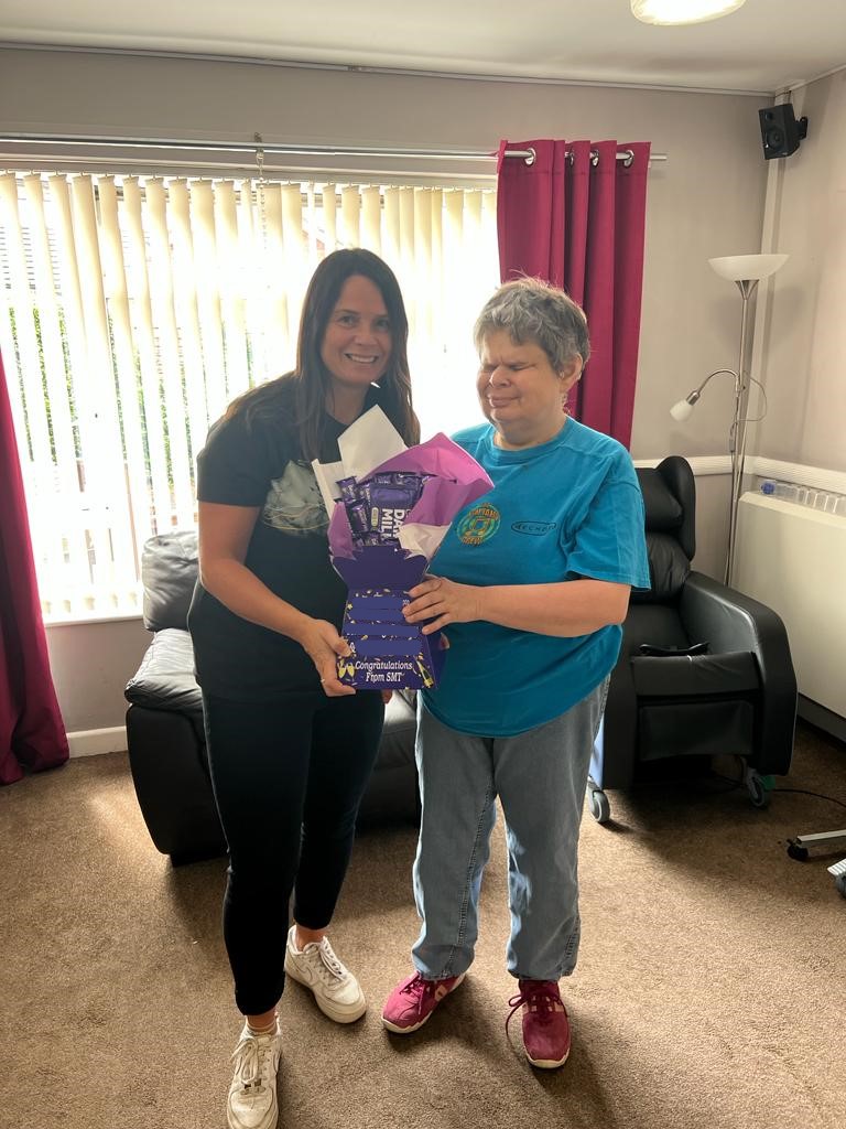 VHA_VisionHomes's tweet photo. The winners of the Kings Coronation photo competition at our 1b Toll Gate Road service won a Cadbury Dairy Milk bouquet, and one of the residents enjoyed a spot of gardening in the lull between the rain. #WinnerAnnouncement #gardening #DisabilityInclusion https://t.co/IZFJN4F5Ef