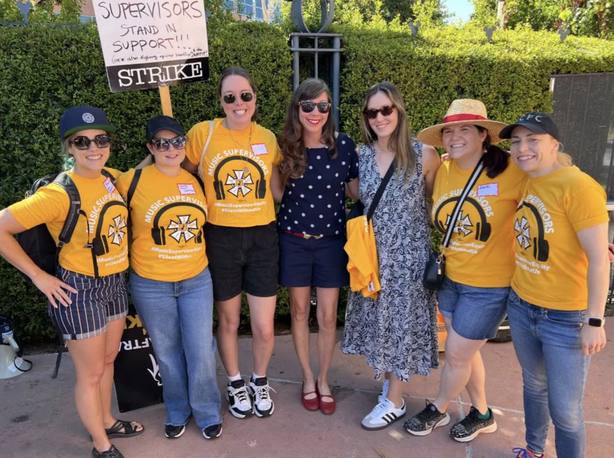 Guild Of Music Supervisors Olivia Schlichting, Jennifer Smith, Alex Dwyer, Nikki Monninger, Hannah Davis, Laura Webb and Heather Guiberg outside of Disney in Burbank today View the full gallery from the #SAGAFTRAStrike here: bit.ly/3DHaRrS 📸 Deadline/Rosy Cordero