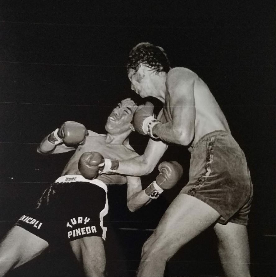 1975: Randy Shields digs into Tury Pineda at the Olympic on his way to a unanimous 10 round decision. Another classic photo by Theo Ehret. #18thandgrand #boxing #boxinghistory #losangeles #lahistory #dtla #olympicauditorium #thisplacematters #1970s #blackandwhitephotography