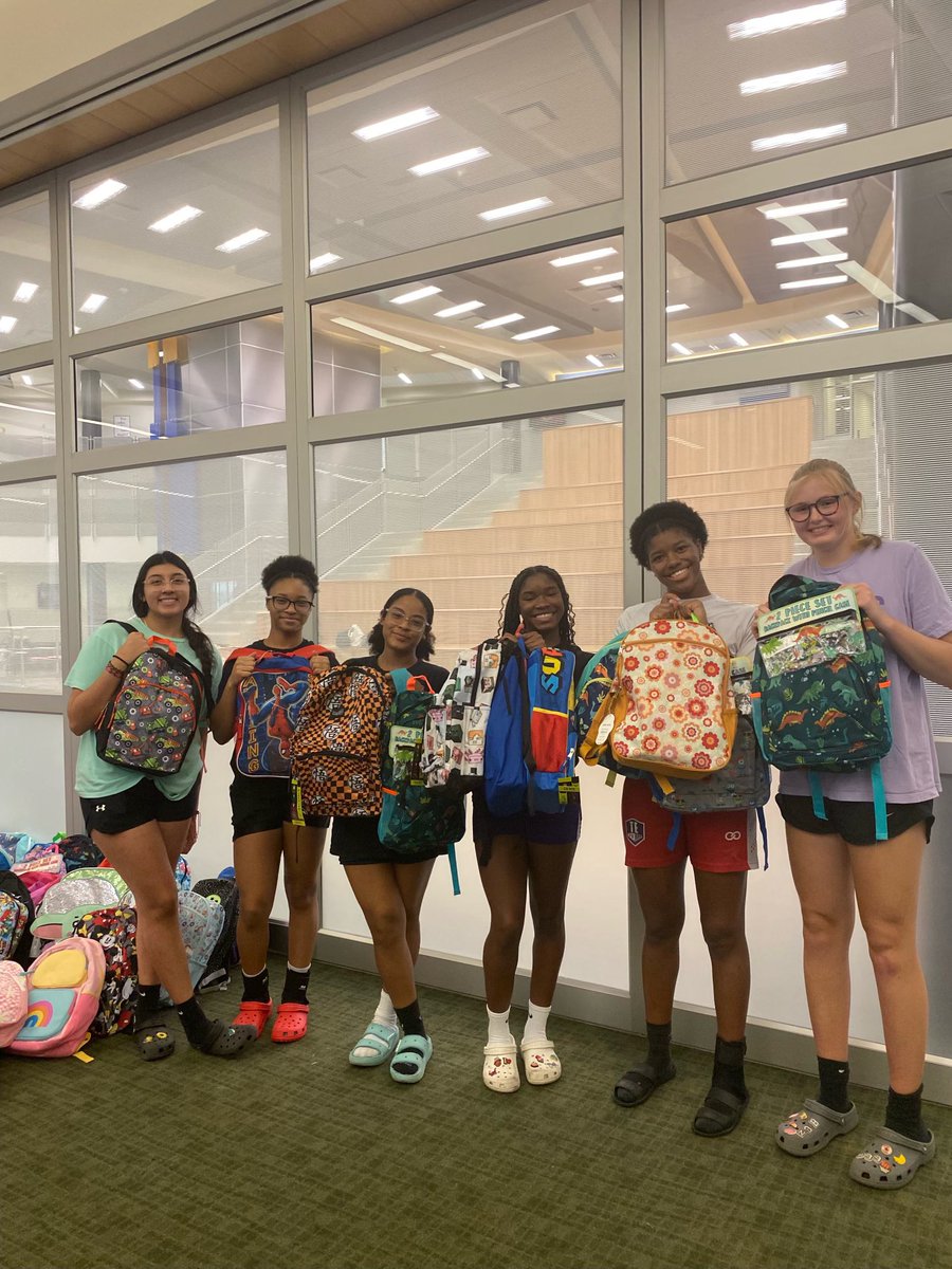 Lady Rangers helping stuff backpacks for the Back 2 School Bash!!